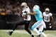 Sep 30, 2013; New Orleans, LA, USA; New Orleans Saints wide receiver Marques Colston (12) carries the ball in front of Miami Dolphins cornerback Jamar Taylor (22) in the second half at Mercedes-Benz Superdome. New Orleans defeated Miami 38-17. Mandatory