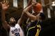 Dec 3, 2013; Durham, NC, USA; Michigan Wolverines guard Nik Stauskas (11) shoots against Duke Blue Devils forward Amile Jefferson (21) at Cameron Indoor Stadium. Mandatory Credit: Mark Dolejs-USA TODAY Sports