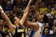 Dec 3, 2013; Durham, NC, USA; Duke Blue Devils forward Jabari Parker (1) shoots over Michigan Wolverines forward Mitch McGary (4) at Cameron Indoor Stadium. Mandatory Credit: Mark Dolejs-USA TODAY Sports