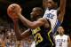 Dec 3, 2013; Durham, NC, USA; Michigan Wolverines guard Caris LeVert (23) drives past Duke Blue Devils forward Amile Jefferson (21) at Cameron Indoor Stadium. Mandatory Credit: Mark Dolejs-USA TODAY Sports