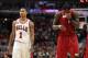 CHICAGO, IL - MAY 26: (L-R) Derrick Rose #1 of the Chicago Bulls looks on as LeBron James #6 of the Miami Heat wipes his face with his jersey in Game Five of the Eastern Conference Finals during the 2011 NBA Playoffs on May 26, 2011 at the United Center i