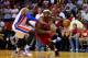 MIAMI, FL - DECEMBER 03: LeBron James #6 of the Miami Heat drives on Josh Smith #6 of the Detroit Pistons during a game at American Airlines Arena on December 3, 2013 in Miami, Florida. NOTE TO USER: User expressly acknowledges and agrees that, by downl