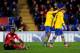 CARDIFF, WALES - NOVEMBER 30: Aaron Ramsey of Arsenal (16) is congratulated by Theo Walcott as he scores their third goal during the Barclays Premier League match between Cardiff City and Arsenal at Cardiff City Stadium on November 30, 2013 in Cardiff, W