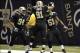 Dec 30, 2012; New Orleans, LA, USA; New Orleans Saints outside linebacker Jonathan Vilma (51) celebrates with teammates defensive end Will Smith (91) and New defensive end Cameron Jordan (94) after scoring a touchdown on an interception off Carolina Panth