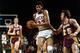 MILWAUKEE - 1970: Kareem Abdul Jabbar #33 of the Milwaukee Bucks drives to the basket against Gail Goodrich #25 of the Los Angeles Lakers during the 1970 season at the MECCA Arena in Milwaukee, Wisconsin. NOTE TO USER: User expressly acknowledges that, b