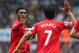 NEWCASTLE UPON TYNE, ENGLAND - OCTOBER 19: Daniel Sturridge of Liverpool high fives Luis Suarez of Liverpool during the Barclays Premier League match between Newcastle United and Liverpool at St James' Park on October 19, 2013 in Newcastle upon Tyne, Eng