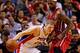 MIAMI, FL - DECEMBER 03: Kyle Singler #25 of the Detroit Pistons drives on LeBron James #6 of the Miami Heat during a game at American Airlines Arena on December 3, 2013 in Miami, Florida. NOTE TO USER: User expressly acknowledges and agrees that, by dow