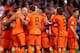 AMSTERDAM, NETHERLANDS - OCTOBER 11: Arjen Robben of Holland (3rd L) celebrates with Robin van Persie (2nd L) during the FIFA 2014 World Cup Qualifing match between Holland and Hungary at Amsterdam Arena on October 11, 2013 in Amsterdam, Netherlands. (P