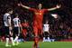LIVERPOOL, ENGLAND - DECEMBER 4: Luis Suarez celebrates the goal of team mate Raheem Sterling during the Barclays Premier League match between Liverpool and Norwich City at Anfield on December 4, 2013 in Liverpool, England. (Photo by Jan Kruger/Getty I