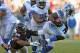 CHICAGO, IL - NOVEMBER 10: Reggie Bush #21 of the Detroit Lions breaks away from James Anderson #50 of the Chicago Bears at Soldier Field on November 10, 2013 in Chicago, Illinois. The Lions defeated the Bears 21-19. (Photo by Jonathan Daniel/Getty Images