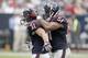 HOUSTON, TX- NOVEMBER 17: Darryl Sharpton #51 celebrates Shiloh Keo #31 of the Houston Texans defensive play against Rashad Jennings #27 of the Oakland Raiders on November 17, 2013 at Reliant Stadium in Houston, Texas. Raiders won 28 to 23.(Photo by Thoma