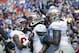 Nov 30, 2013; Gainesville, FL, USA; Florida State Seminoles wide receiver Kelvin Benjamin (1) is congratulated by wide receiver Rashad Greene (80), offensive linesman Bobby Hart (51) and teammates after he scored a touchdown against the Florida Gators dur