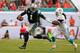 MIAMI GARDENS, FL - NOVEMBER 24: Cam Newton #1 of the Carolina Panthers scrambles during a game against the Miami Dolphins at Sun Life Stadium on November 24, 2013 in Miami Gardens, Florida. (Photo by Mike Ehrmann/Getty Images)