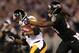 BALTIMORE, MD - NOVEMBER 28: Wide receiver Antonio Brown #84 of the Pittsburgh Steelers is tackled by cornerback Lardarius Webb #21 of the Baltimore Ravens after catching a first half pass at M&T Bank Stadium on November 28, 2013 in Baltimore, Maryland.