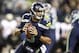 Dec 2, 2013; Seattle, WA, USA; Seattle Seahawks quarterback Russell Wilson (3) looks to pass against the New Orleans Saints during the first quarter at CenturyLink Field. Mandatory Credit: Joe Nicholson-USA TODAY Sports