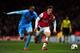 LONDON, ENGLAND - NOVEMBER 26: Kassim Abdallah of Marseille and Aaron Ramsey of Arsenal battle for the ball during the UEFA Champions League Group F match between Arsenal and Olympique de Marseille at Emirates Stadium on November 26, 2013 in London, Engl