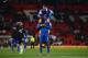 MANCHESTER, ENGLAND - DECEMBER 04: Bryan Oviedo of Everton celebrates with team-mate Sylvain Distin at the end of the Barclays Premier League match between Manchester United and Everton at Old Trafford on December 4, 2013 in Manchester, England. (Photo