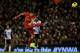 LIVERPOOL, ENGLAND - DECEMBER 4: Luis Suarez of Liverpool scores his first goal from a long range effort during the Barclays Premier League match between Liverpool and Norwich City at Anfield on December 4, 2013 in Liverpool, England. (Photo by Jan Kru