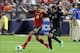 Jun 11, 2013; Bronx, NY, USA; Spain defender Jordi Alba (18) and Republic of Ireland defender Seamus Coleman (2) fight for the ball during the second half of a friendly match at Yankee Stadium. Spain defeated the Republic of Ireland 2-0. Mandatory Credit: