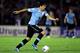 MONTEVIDEO, URUGUAY - NOVEMBER 20: Luis Suarez of Uruguay runs with the ball during leg 2 of the FIFA World Cup Qualifier match between Uruguay and Jordan at Centenario Stadium Stadium on November 20, 2013 in Montevideo, Uruguay. (Photo by Friedemann Vo
