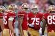 Dec 1, 2013; San Francisco, CA, USA; San Francisco 49ers quarterback Colin Kaepernick (7) stands in the huddle before running a play against the St. Louis Rams in the fourth quarter at Candlestick Park. The 49ers defeated the Rams 23-13. Mandatory Credit:
