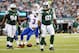 Sep 22, 2013; East Rutherford, NJ, USA; New York Jets defensive end Sheldon Richardson (91) reacts after sacking Buffalo Bills quarterback EJ Manuel (3) during the third quarter at MetLife Stadium. Mandatory Credit: Anthony Gruppuso-USA TODAY Sports