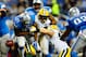 Nov 28, 2013; Detroit, MI, USA; Green Bay Packers outside linebacker Clay Matthews (52) forces Detroit Lions running back Reggie Bush (21) to fumble the ball during the first quarter of a NFL football game on Thanksgiving at Ford Field. Mandatory Credit: