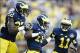 Oct 5, 2013; Ann Arbor, MI, USA; Michigan Wolverines defensive back Blake Countess (18) receives congratulations from safety Jarrod Wilson (22) and cornerback Courtney Avery (11) after scoring on a interception return in the fourth quarter against the Min
