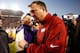 Les Miles (left) shakes hands with Bret Bielema (right) after the game.