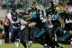 JACKSONVILLE, FL - DECEMBER 05: Geno Hayes #55 of the Jacksonville Jaguars attempts to tackle Andre Johnson #80 of the Houston Texans during the game at EverBank Field on December 5, 2013 in Jacksonville, Florida. (Photo by Sam Greenwood/Getty Images)