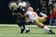 November 25, 2012; New Orleans, LA, USA; New Orleans Saints running back Darren Sproles (43) carries the ball against San Francisco 49ers strong safety Donte Whitner (31) during first quarter of their game at the Mercedes-Benz Superdome. Mandatory Credi