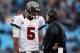 CHARLOTTE, NC - NOVEMBER 18: Josh Freeman #5 of the Tampa Bay Buccaneers talks to head coach Greg Schiano during their game against the Carolina Panthers at Bank of America Stadium on November 18, 2012 in Charlotte, North Carolina. (Photo by Streeter Le
