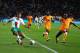 PORT ELIZABETH, SOUTH AFRICA - JUNE 15: Cristiano Ronaldo of Portugal crosses the ball as Didier Zokora of Ivory Coast defends during the 2010 FIFA World Cup South Africa Group G match between Ivory Coast and Portugal at Nelson Mandela Bay Stadium on June