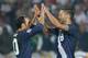RUSTENBURG, SOUTH AFRICA - JUNE 12: Clint Dempsey (R) and Landon Donovan of the United States celebrate at the final whistle during the 2010 FIFA World Cup South Africa Group C match between England and USA at the Royal Bafokeng Stadium on June 12, 2010