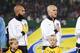 VIENNA, AUSTRIA - NOVEMBER 19: Goalkeeper Tim Howard, Michael Bradley and Omar Gonzales of USA (L-R) line up for the national anthem prior to the International friendly match between Austria and USA at the Ernst-Happel Stadium on November 19, 2013 in Vie