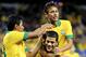 TORONTO, ON - NOVEMBER 19: Hulk #19 of Brazil is congratulated by teammates Paulinho #18 and Neymar #10 after scoring in the first half against Chile during a friendly match at Rogers Centre on November 19, 2013 in Toronto, Canada. (Photo by Elsa/Getty