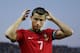 FARO, PORTUGAL - AUGUST 14: Cristiano Ronaldo of Portugal brushes his hair with water prior to start the International Friendly match between Portugal and Netherlands at Estadio Algarve on August 14, 2013 in Faro, Portugal. (Photo by Gonzalo Arroyo Moren
