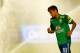 MIAMI GARDENS, FL - NOVEMBER 16: Neymar #10 of Brazil runs off of the field as the sprinklers start up prior to the game against Honduras during a friendly match at Sun Life Stadium on November 16, 2013 in Miami Gardens, Florida. (Photo by Jared Wickerha