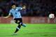 MONTEVIDEO, URUGUAY - NOVEMBER 20: Luis Suarez of Uruguay runs with the ball during leg 2 of the FIFA World Cup Qualifier match between Uruguay and Jordan at Centenario Stadium Stadium on November 20, 2013 in Montevideo, Uruguay. (Photo by Friedemann Vo
