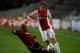 AMSTERDAM, NETHERLANDS - OCTOBER 01: Daley Blind of Ajax is tackled by Nigel De Jong of AC Milan during the UEFA Champions League Group H match between Ajax Amsterdam and AC Milan at Amsterdam Arena on October 1, 2013 in Amsterdam, Netherlands. (Photo b