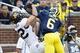 Oct 5, 2013; Ann Arbor, MI, USA; Michigan Wolverines defensive back Raymon Taylor (6) breaks up a pass to Minnesota Golden Gophers wide receiver Drew Wolitarsky (82) in the second half at Michigan Stadium. Michigan won 42-13. Mandatory Credit: Rick Osento