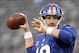 Nov 17, 2013; East Rutherford, NJ, USA; New York Giants quarterback Eli Manning (10) warms up before the game against the Green Bay Packers at MetLife Stadium. Mandatory Credit: Robert Deutsch-USA TODAY Sports