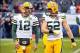Dec 16, 2012; Chicago, IL, USA; Green Bay Packers quarterback Aaron Rodgers (12) talk with outside linebacker Clay Matthews (52) before the game against the Chicago Bears at Soldier Field. Mandatory Credit: Rob Grabowski-USA TODAY Sports