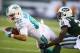 EAST RUTHERFORD, NJ - DECEMBER 01: Brian Hartline #82 of the Miami Dolphins dives for a gain as Ellis Lankster #21 of the New York Jets makes the tackle during their game at MetLife Stadium on December 1, 2013 in East Rutherford, New Jersey. (Photo by