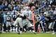 Dec 22, 2012; Charlotte, NC, USA; Oakland Raiders quarterback Carson Palmer (3) is hurt as he is hit by Carolina Panthers defensive end Greg Hardy (76) and defensive end Charles Johnson (95) helps defend in the first quarter at Bank of America Stadium. Ma