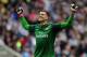 NEWCASTLE UPON TYNE, ENGLAND - MAY 19: Wojciech Szczesny of Arsenal celebrates after team-mate Laurent Koscielny scored the opening goal during the Barclays Premier League match between Newcastle United and Arsenal at St James' Park on May 19, 2013 in Ne