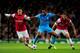 LONDON, ENGLAND - NOVEMBER 26: Mesut Oezil of Arsenal and Alaixys Romao of Marseille battle for the ball during the UEFA Champions League Group F match between Arsenal and Olympique de Marseille at Emirates Stadium on November 26, 2013 in London, England