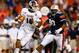 AUBURN, AL - SEPTEMBER 14: Dak Prescott #15 of the Mississippi State Bulldogs rolls out away from Gabe Wright #90 of the Auburn Tigers at Jordan-Hare Stadium on September 14, 2013 in Auburn, Alabama. (Photo by Kevin C. Cox/Getty Images)