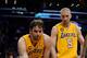 Apr 12, 2013; Los Angeles, CA, USA; Los Angeles Lakers power forward Pau Gasol (16) helps shooting guard Kobe Bryant (24) after an injury against the Golden State Warriors during the game at Staples Center. Mandatory Credit: Richard Mackson-USA TODAY Spor