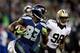 SEATTLE, WA - DECEMBER 02: Wide receiver Ricardo Lockette #83 of the Seattle Seahawks runs with the ball as outside linebacker Parys Haralson #98 of the New Orleans Saints defends during a game at CenturyLink Field on December 2, 2013 in Seattle, Washingt